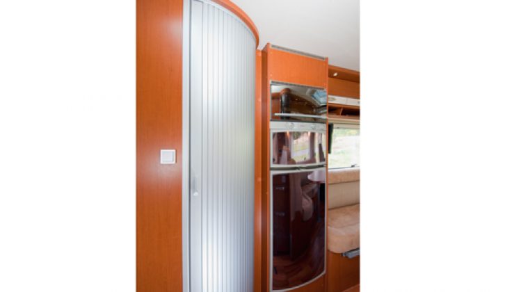 2011 Hymer B544 – interior (looking at washroom door and fridge)