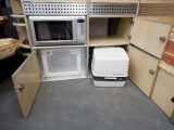 2007 Torbay Fusion - storage in kitchen area, including Porta Potti