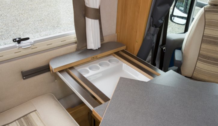2007 Adria Coral 660SL - dinette table extension with tray beneath