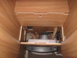 2011 Swift Escape 696 – space heater under wardrobe with clever access hatch