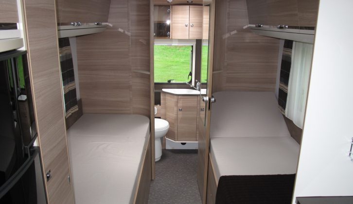 The 2014 Coral Axess' rear washroom and fixed twin beds.