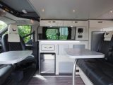Seating for four inside the Wellhouse Ford Terrier Bianco campervan