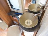 You'll find a separate shower compartment and a round basin in this Chausson's washroom