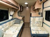 There's room for six to sit, or four to dine in the Lounge in the Auto-Sleepers Kemerton XL, when you swivel the two cab seats round to face the sofa
