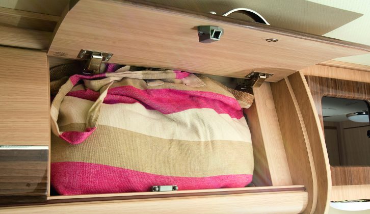 Considering this is a van conversion, there's bags of room in the deep overhead lockers