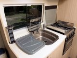 The kitchen has plenty of storage and worktop space for a two-berth high-top van conversion type of motorhome