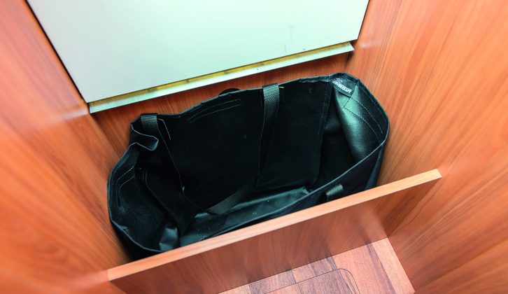 One of the steps to the rear bed area lifts up to reveal a storage cubby with a handy built-in bag – useful for keeping laundry out of sight