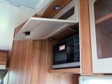 Having the microwave in the locker looks better, but makes it trickier to use, report Practical Motorhome's reviewers