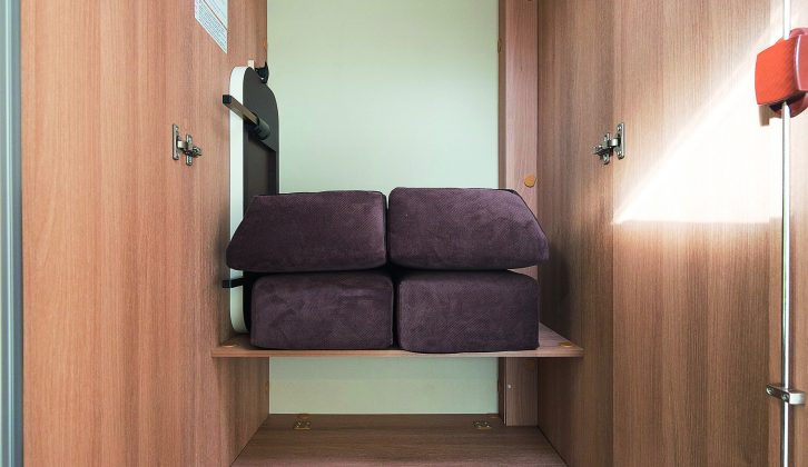 The three-quarter-length wardrobe sits atop a cupboard with two shelves and retaining rails to keep items safely inside in transit, in the Roller Team Zefiro 690G