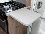 A flip-up worktop extension allows extra preparation space for motorcaravanning cooks, but care should be taken with people using the entrance door