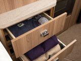 The bedroom has a wealth of storage options: four cupboards and three drawers, including these located next to the bed in the Swift Esprit 494