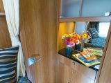 The dresser opposite the bed has a mirror and cupboards, and is ideal for using a hairdryer while sitting on the bed