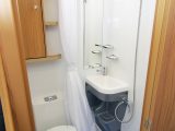 Bailey Approach Advance 615 washroom has a swivel electric-flush toilet set a bit too close to the washbasin, but storage is good and there's a huge fully lined cubicle with a shower curtain to stop the toilet getting wet