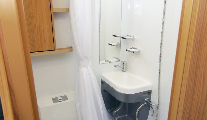 Bailey Approach Advance 615 washroom has a swivel electric-flush toilet set a bit too close to the washbasin, but storage is good and there's a huge fully lined cubicle with a shower curtain to stop the toilet getting wet