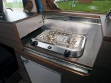 The kitchen worktop's built-in storage compartment is in a section that cleverly slides out of the way to reveal two gas rings, but the driver's seat has to be in its furthest-forward position
