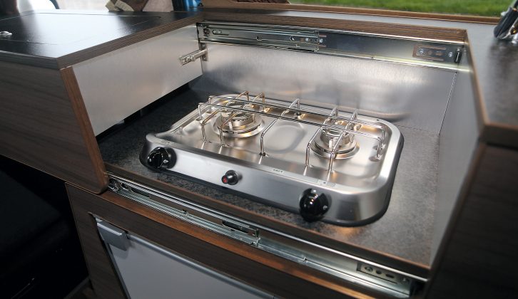 The kitchen worktop's built-in storage compartment is in a section that cleverly slides out of the way to reveal two gas rings, but the driver's seat has to be in its furthest-forward position