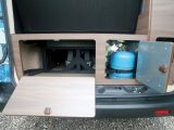At the rear of Hillside Leisure's Dalbury E campervan is a handy storage cavity next to the gas locker and there's a small cubby hole to the right as well