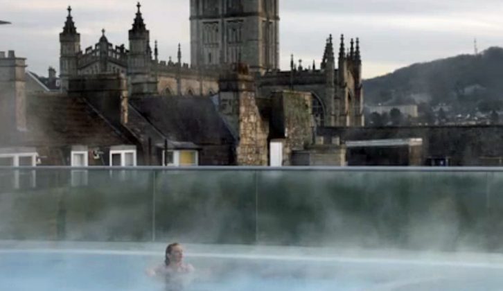Practical Motorhome's Clare Kelly enjoys the steam in the Roman Baths on a winter's day, for The Motorhome Channel TV show