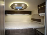 The transverse fixed bed in the Pilote Galaxy G740 G Sensation,  has a memory foam mattress and is accessed via a couple of corner steps. A sliding door closes the area off