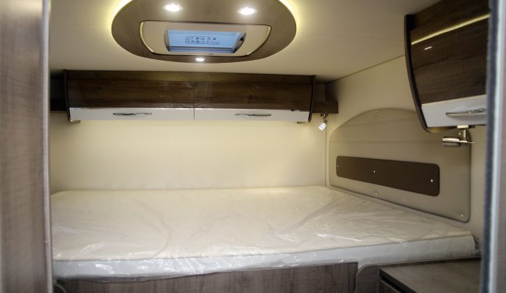 The transverse fixed bed in the Pilote Galaxy G740 G Sensation,  has a memory foam mattress and is accessed via a couple of corner steps. A sliding door closes the area off