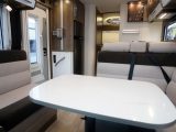The dining area in the Pilote Galaxy G740 G Sensation will comfortably seat five people with the cab seats swivelled and the table slid towards the wide offside seat. The fabric scheme as fitted to our test 'van was Pastel Brown, paired with the Chambord cabinetwork finish