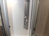 The nearside shower cubicle is well lined and sealed in the Shower in the Pilote Galaxy G740 G Sensation motorhome. Access is via a bi-fold door and there are places for lotions and soap