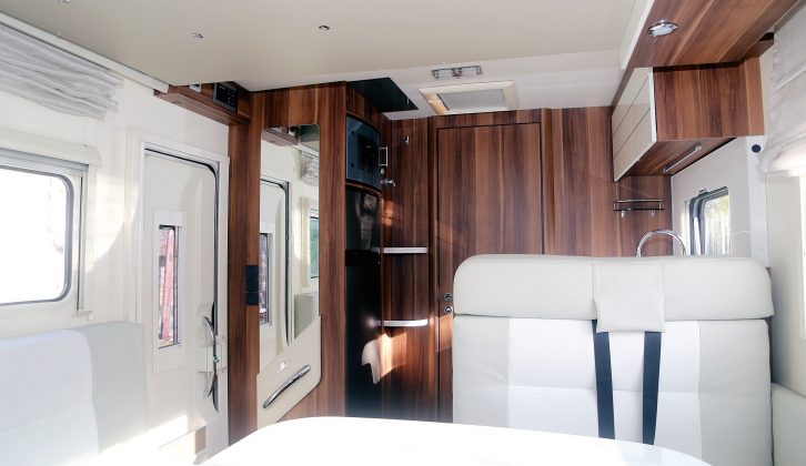 Clever design makes the most of the space in thie sub-6m long T-Line 590 motorhome. Two belted seats in the lounge double as a sofa during the day. They and the two swivelling front cab seats provide space for four people to dine around the sliding tabletop in comfort