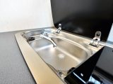 Keep a lid on it – the sink and hob share a single stainless steel unit. Both have glass lids to increase your food preparation space. Hot water is an option in this micro coachbuilt camper