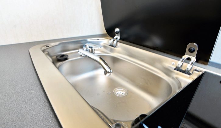 Keep a lid on it – the sink and hob share a single stainless steel unit. Both have glass lids to increase your food preparation space. Hot water is an option in this micro coachbuilt camper