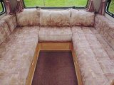 The comfortable rear lounge in the Compass Drifter motorhome (1987-1995) has lounging pillows
