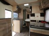 The Rimor Koala Elite 655 layout has a rear French bed and corner washroom, while the kitchen features a Webasto compressor fridge