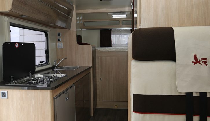 There's a transverse rear double bed over a large rear garage, plus an offside kitchen and nearside washroom with walk-in shower compartment in the Rimor Koala Elite 722
