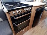 Kitchen kit – including the cooker and fridge – is satisfactory, but the storage space is squeezed, like the cupboard between them in the Bessacarr Hi-Style 496