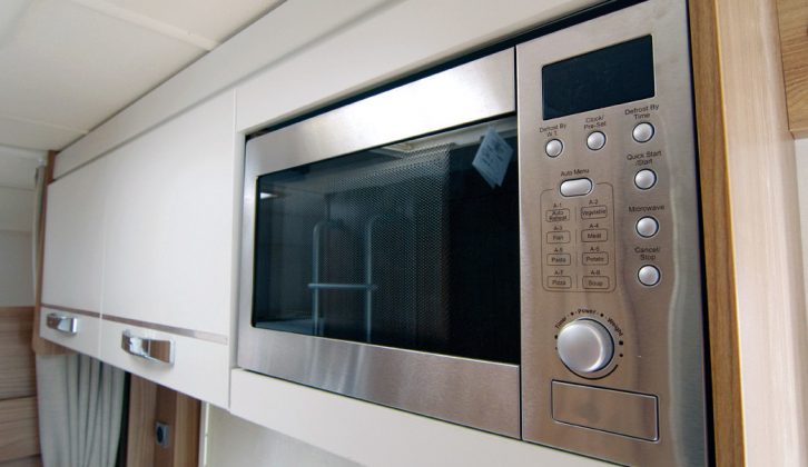 The kitchen is equipped with a microwave oven in the Swift Lifestyle dealer specials made for Marquis