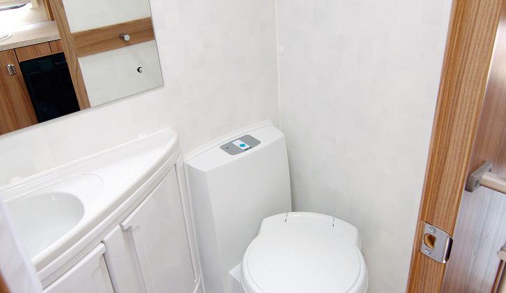 The wetroom houses a toilet, washbasin, vanity unit, towel ring and shower in the Lifestyle range