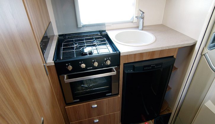 The end kitchen has a three-burner hob and combi oven/grill plus good-sized fridge in the Lifestyle range