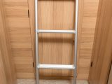 Rather than space-sapping wooden steps for the rear bed, Bailey uses this neat pull-out ladder that stores in the roof of the garage