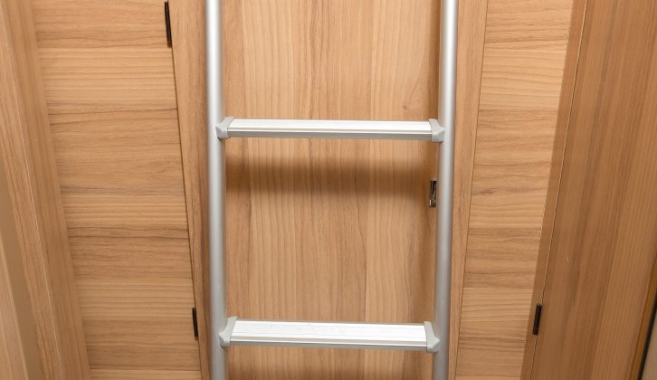Rather than space-sapping wooden steps for the rear bed, Bailey uses this neat pull-out ladder that stores in the roof of the garage