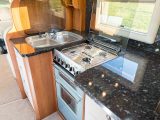 The excellent kitchen has four gas burners, a separate oven and grill, a microwave, an extractor fan, a fridge/freezer and ample storage