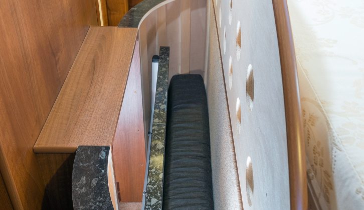 When not in use, the infill cushions – and folding lounge table – are stowed in a compartment at the foot of the rear double bed