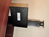 This bracket for a flatscreen TV is pulled down for use – when you’re not using it, stow it away by sliding it behind a roof locker