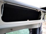 There are five overhead lockers to choose from, with gloss-finish ivory facings. They open on struts and secure via positive catches in the Auto Campers Leisure Van