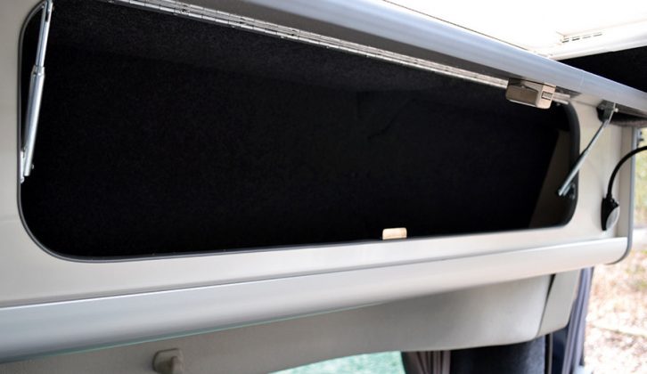 There are five overhead lockers to choose from, with gloss-finish ivory facings. They open on struts and secure via positive catches in the Auto Campers Leisure Van