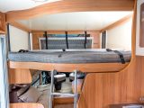 The double bed lowers from the ceiling at the push of a button, and is accessed via a ladder that is otherwise stashed in the wardrobe of the Approach Compact 540
