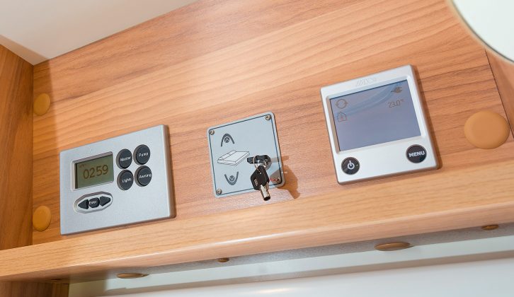 The main control panel, the electric drop-down bed control and the touchscreen unit for the Alde system are sited above the entry door