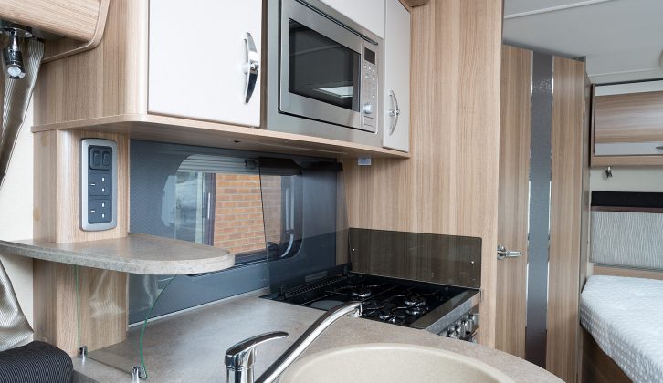 The plinth for the circular sink stands proud from the side of the ’van, and neatly divides the kitchen from the lounge area.