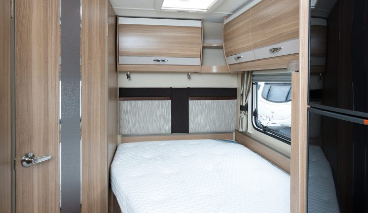 The rear bedroom is well equipped, with a Duvalay mattress, overhead storage and twin reading lights. 
The mattress cutaway is quite pronounced, though