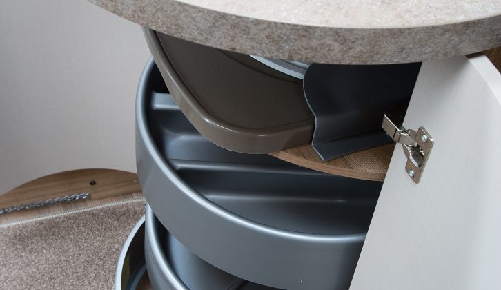 Underneath the kitchen sink there’s a cupboard with plenty of storage, utilising rotating grey plastic trays. It looks great, and is very practical