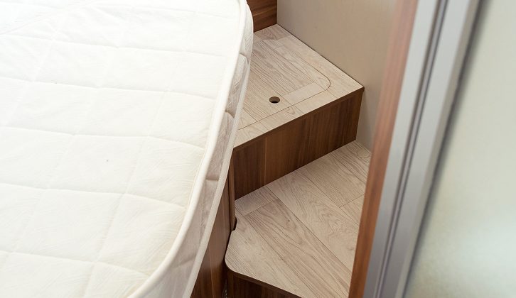 The steps around both sides of the fixed bed in the T-Line 740 have good clearance and offer handy storage cubbies for items you need to access quickly