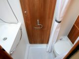 The washroom made clever use of the available space. Opposite the sink on the nearside are the toilet and a large cupboard